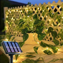 Luz solar de cordão com folhas verdes para decoração externa à noite
